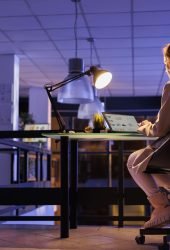 advisor-agent-analyzing-marketing-graphs-on-laptop-2023-11-27-04-57-34-utc