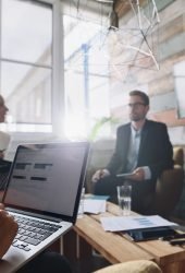 businesswoman-working-on-laptop-in-meeting-2024-09-18-23-58-10-utc