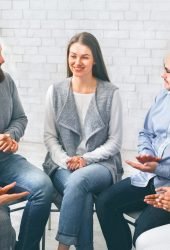 community-members-applauding-to-mentor-at-therapy-2024-03-19-21-05-54-utc