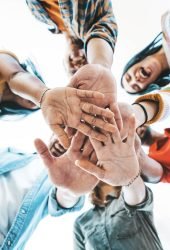 community-of-millennial-people-stacking-hands-toge-2023-11-27-05-09-48-utc