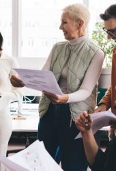 confident-executive-managers-with-paper-reports-an-2024-05-20-16-54-06-utc