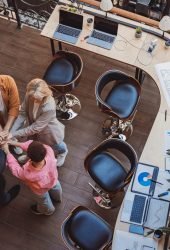 top-view-of-colleagues-putting-their-arms-in-centr-2023-11-27-05-14-17-utc