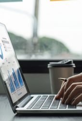 young-businesswoman-works-on-charts-and-graphs-sho-2025-01-16-13-15-52-utc